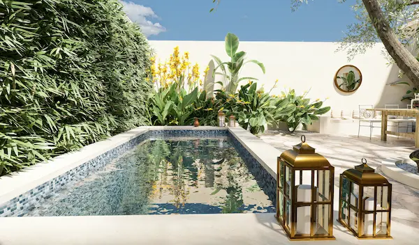 Small courtyard pool with tropical planting, gold lanterns, circular mirror and shaded dining area in a Mediterranean dry‑climate garden in Madrid