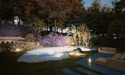 Pool with warm lighting and perennial Mediterranean vegetation at dusk in Catalonia