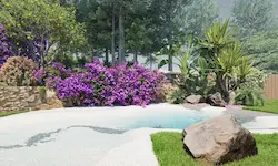 Piscina orgánica rodeada de arbustos florales y limonero en un jardín mediterráneo de Catalunya
