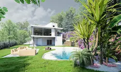 Zona de estar exterior con vegetación mediterránea junto a fachada moderna en Catalunya